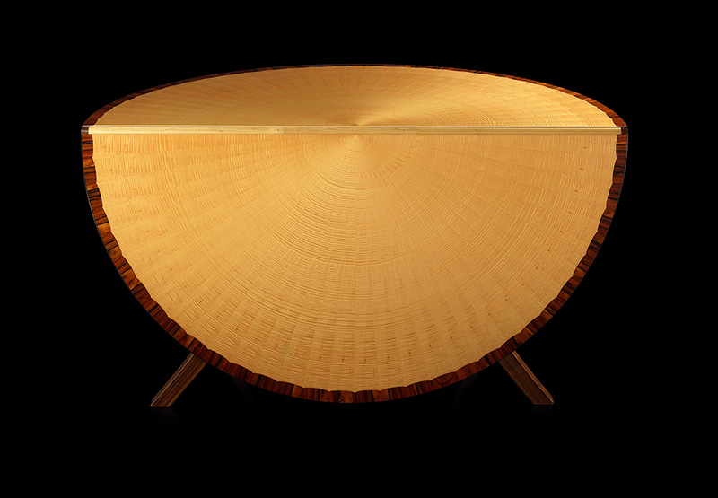 Circular dining table in Rippled Sycamore and Rio Rosewood edging