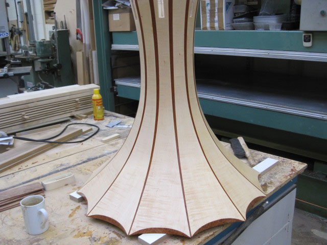 Circular table in ripple Maple veneer with burr Maple edge detail and Mahogany stringing