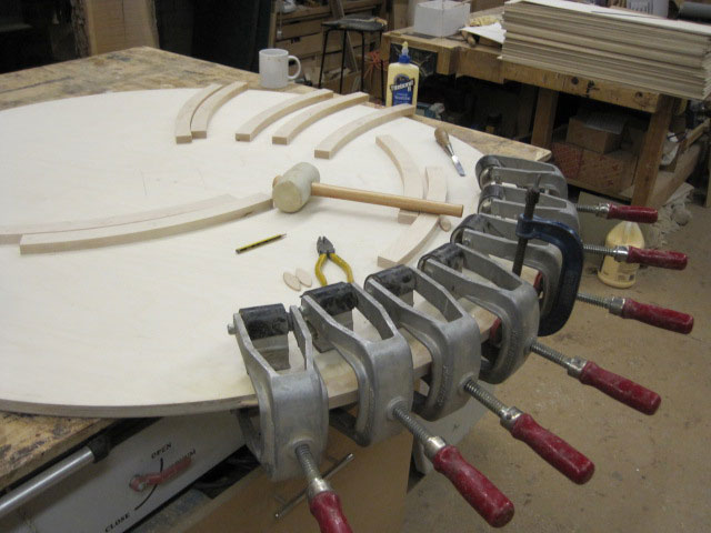 Circular table in ripple Maple veneer with burr Maple edge detail and Mahogany stringing
