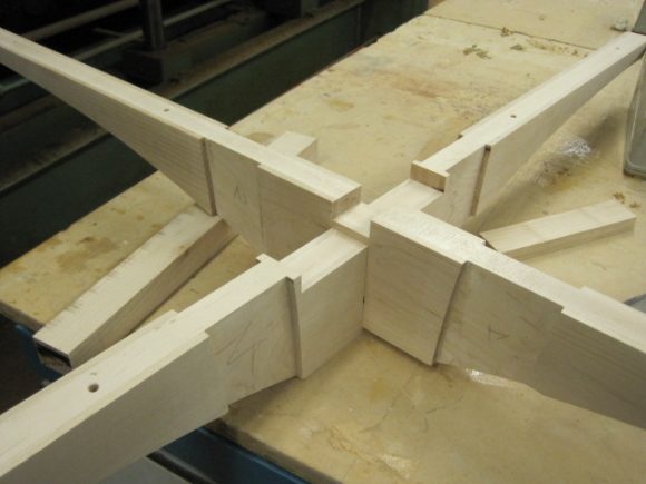 The table top support, which in this instance was two rails cross halved together.
