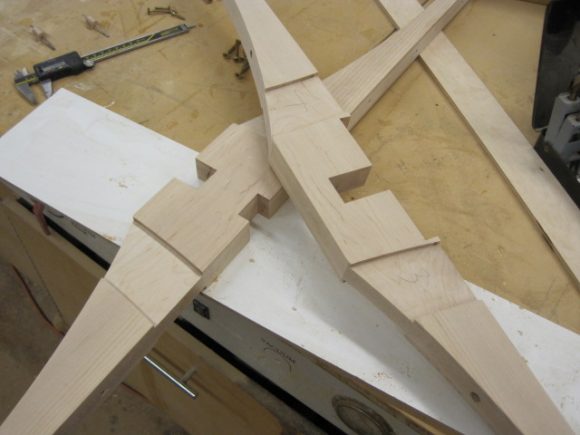 The table top support, which in this instance was two rails cross halved together.